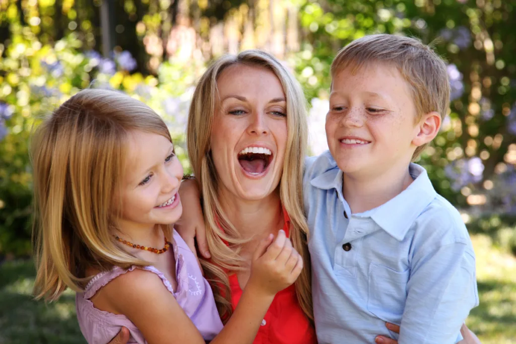 mom laughing with kids